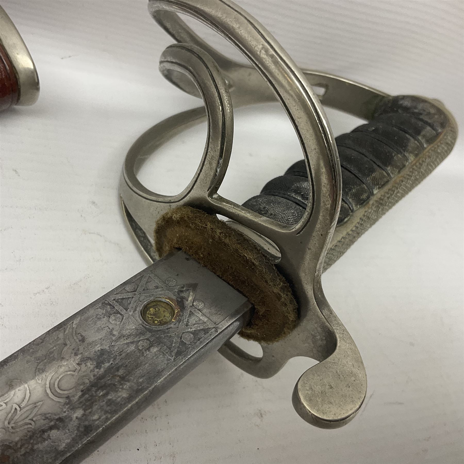 WWI 1821 pattern Royal Artillery officer's sword, the 82.5cm decorative blade by Hawksworth Sheffield etched with GVR cypher and crown, 'Royal Artillery' and field gun between scrolling foliate panels; three-bar hilt with wire-bound fish skin grip and chequered backstrap; in leather covered scabbard L99cm overall