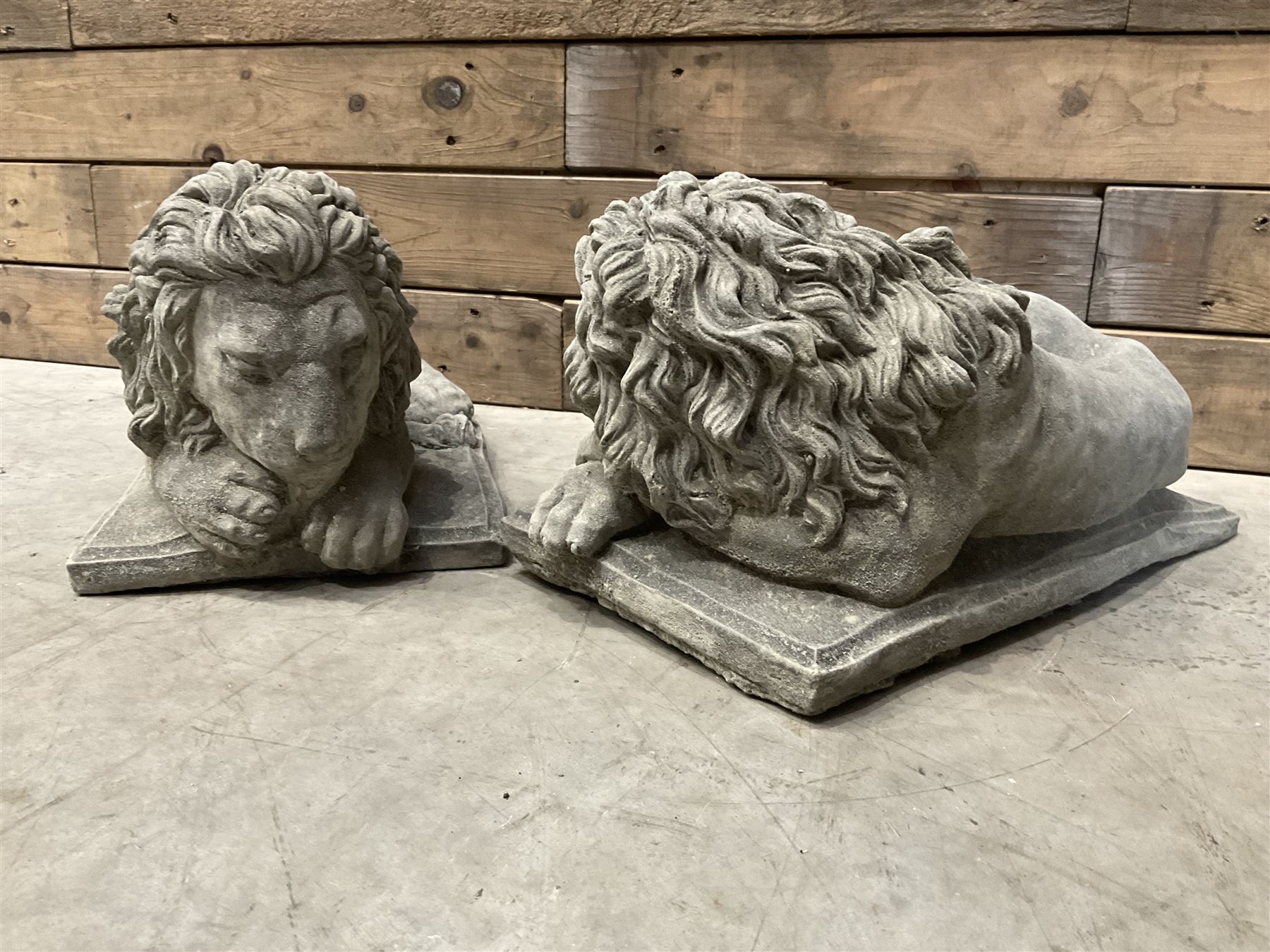Pair of small recumbent garden lions