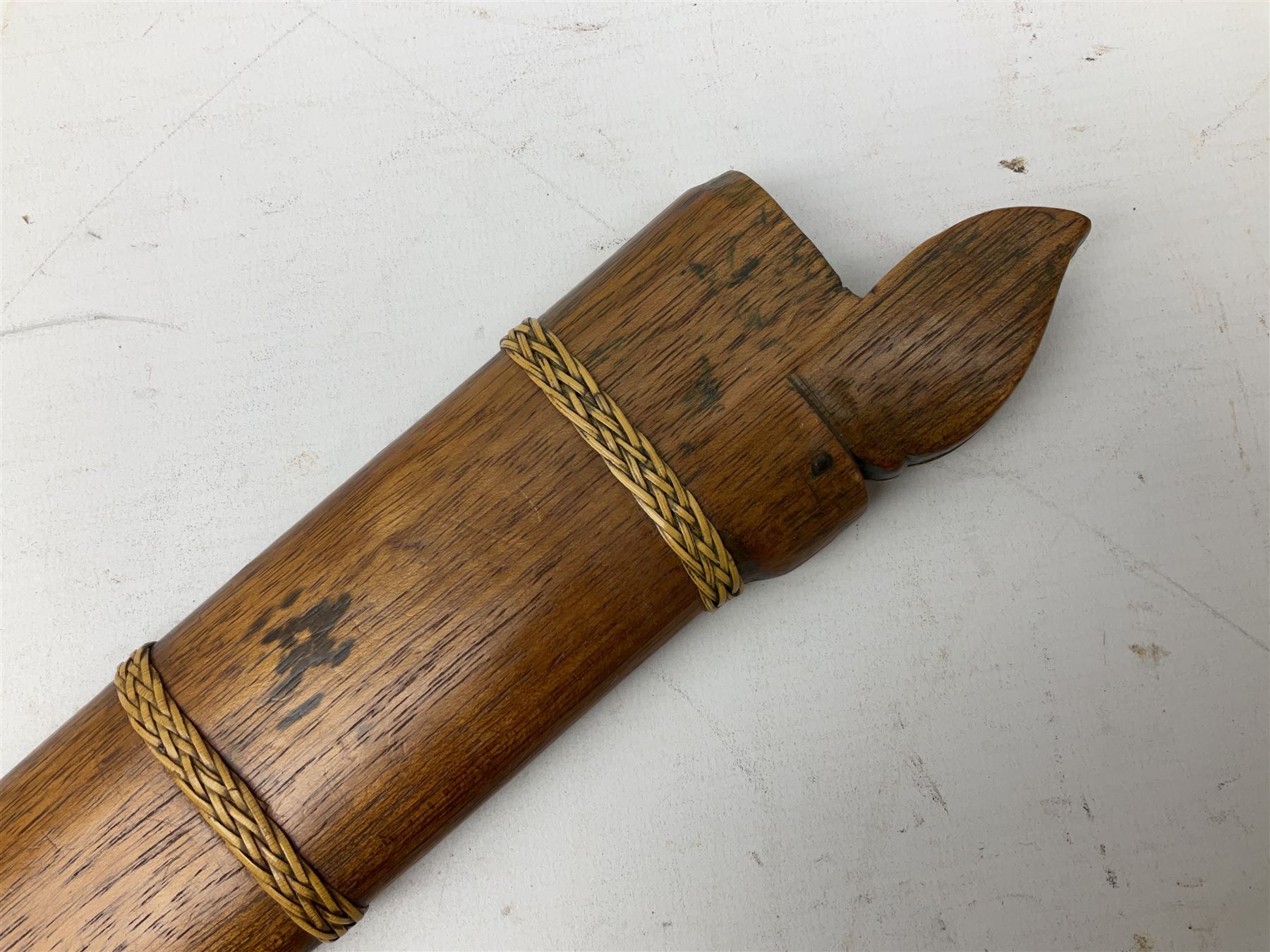 Malaysian parang survival knife the 29cm steel blade with character marks, cane bound teak grip carved with a stylised turtle head to the pommel, with matching teak scabbard L46cm overall