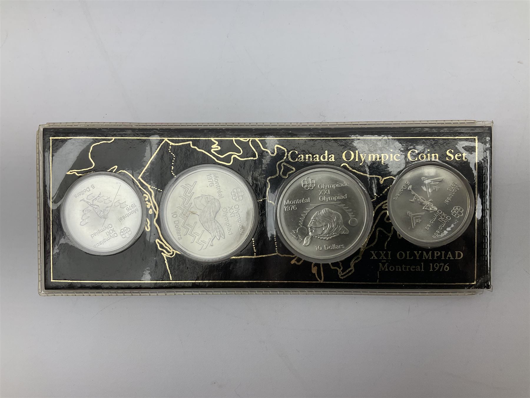 Canadian coinage including Queen Elizabeth II 1964 and four 1966 dollars, 1975 Olympic four coin set comprising two five dollar and two ten dollar coins, 1995 specimen coin set in blue folder, 1995 uncirculated coin set etc 