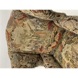 Matched pair early 20th century Queen Anne style wingback armchairs, walnut framed, sprung seats with seat cushions upholstered in needle work cover, shell carved cabriole front feet