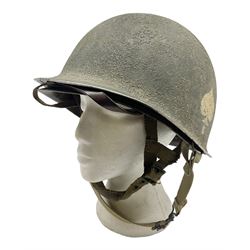 American first type paratrooper helmet with post-WW2 strap and D-rings and later 1944 liner bearing Firestone Tyre and Rubber Company mark; green textured finish