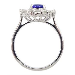 18ct white gold oval tanzanite, taped baguette and round brilliant cut diamond cluster ring, stamped 750, tanzanite approx 1.30 carat, total diamond weight approx 0.50 carat