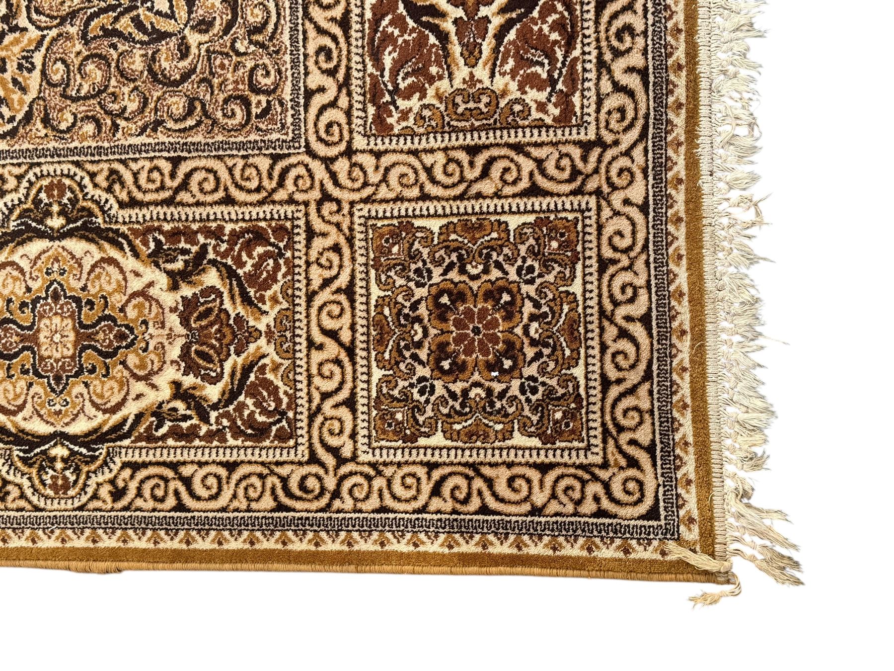 Persian Tabriz ivory ground rug, the field centred by a shaped floral medallion with swirling spandrels, richly decorated with foliate motifs, the broad border with matching cartouches and palmettes, within multiple guard stripes