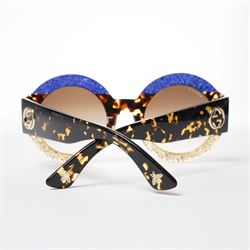 Gucci - pair of oversized round sunglasses, with gradient tinted lenses in a tortoiseshell-effect frame with blue and gold glitter inlay, the temples with interlocking gold-tone GG logo and bee motif, unused with original cloth and hard cases
