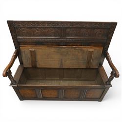 Victorian Jacobean Revival carved oak settle or hall bench with box seat, the cresting rail carved with repeating lunette motifs with acanthus and rosette decoration, over four back panels and hinged box seat, the panelled base raised on stile supports