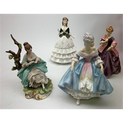 A group of figurines, comprising two boxed Spode Pauline Shine examples, Lily and Olivia (one a/f), a Royal Douton figurine First Dance modelled by F G Doughty, a further Royal Doulton figurine, Debutante, a Royal Doulton figurine, Southern Belle HN2425, and an unmarked continental figurine. 