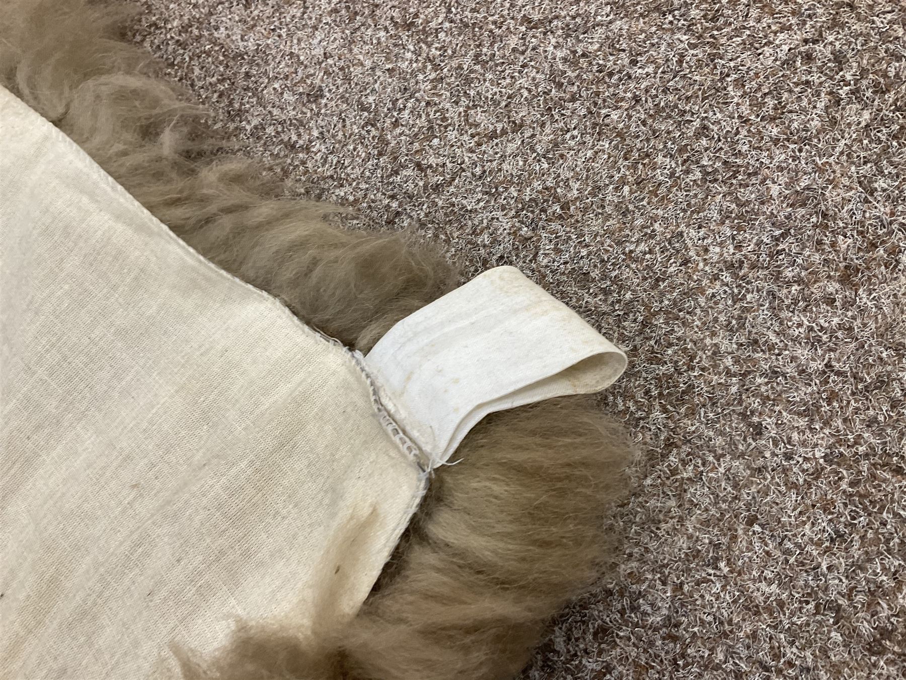 Alpaca rug/wall hanging depicting a gorilla on a cream background 