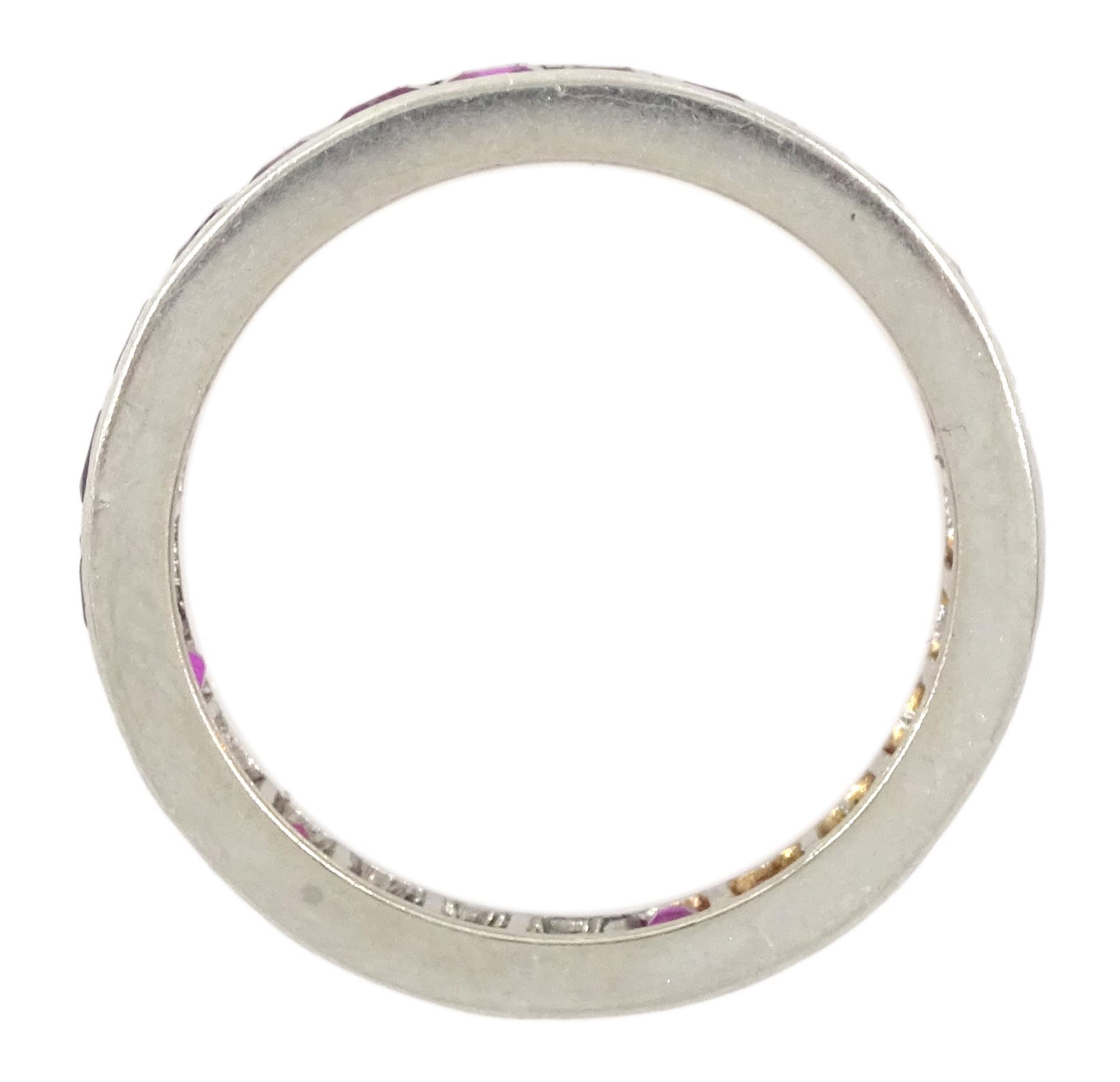 Platinum channel set, calibre cut ruby full eternity ring  