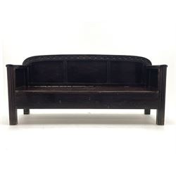 Scandinavian stained wood box settle, arched panelled back carved with clubs, hinged seat