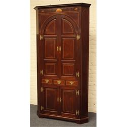  Large George III mahogany corner cupboard, projecting cornice above frieze inlaid with shell motifs, two arched fielded panelled doors above three small drawers and double cupboard, painted interior fitted with shaped shelves, box wood stringing, W120cm, H228cm  