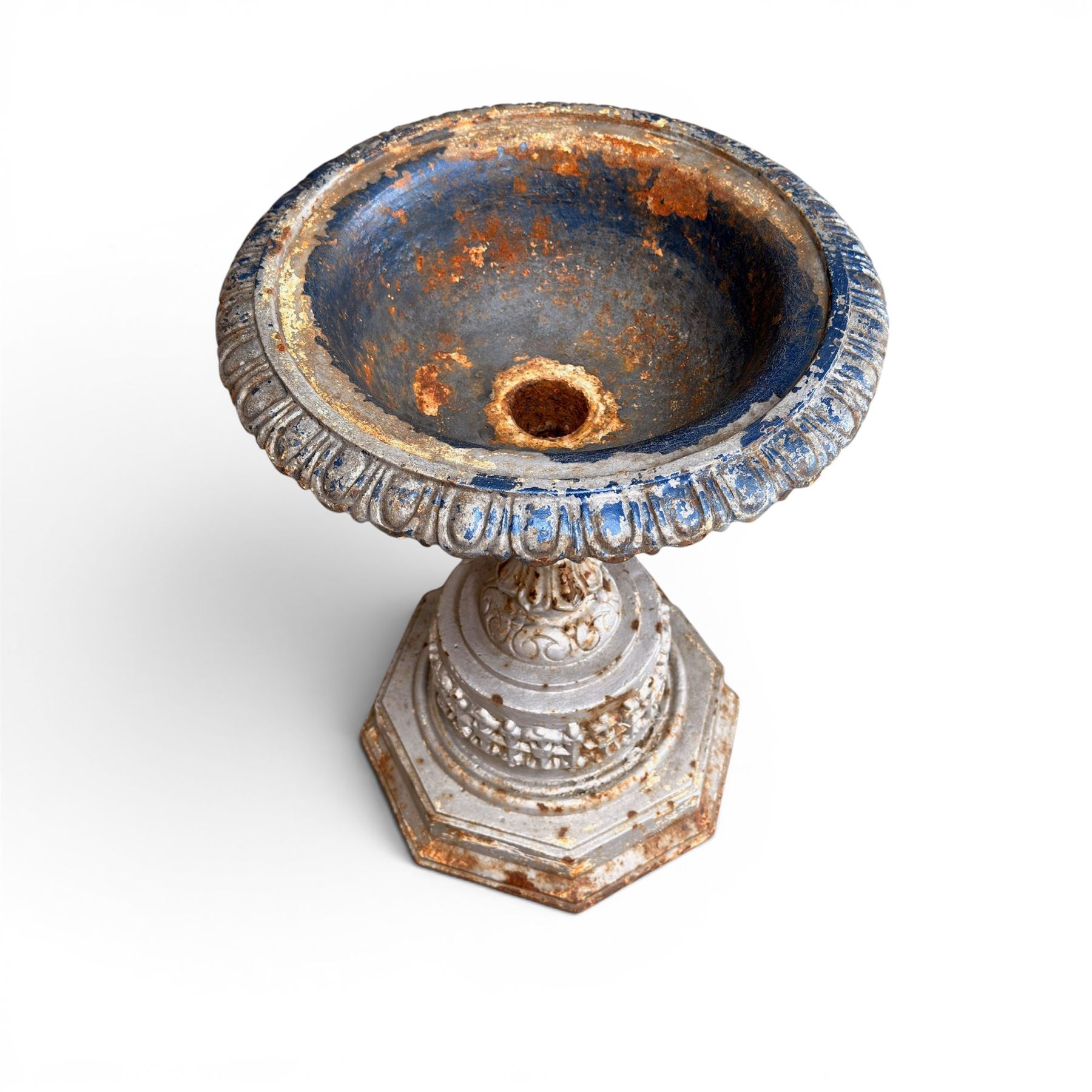 Small ornate painted 19th-century Meadow Foundry cast iron centrepiece urn, with wide, scalloped bowl rim decorated with a repeating egg and dart decoration, supported on a slender fluted pedestal with raised quatrefoil design on an octagonal plinth base  