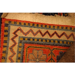  Turkish blue ground rug, geometric and stylised design, 207cm x 126cm  