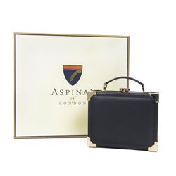 Aspinal of London black leather structured top-handle handbag with gold-tone metal mounts and corner protectors, the hinged lid opening to a fabric-lined interior fitted with a zip pocket and slip compartment, leather brand label stamped Aspinal of London England, fitted with a detachable adjustable leather shoulder strap, accompanied by an Aspinal of London dust bag and presentation box, W19cm D8cm H16cm