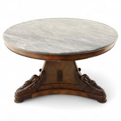 French mid-19th-century Second-Empire mahogany centre table with a dished grey-veined marble top, on a tapered triform pedestal with anthemion brass mounts above carved recumbent swan figures with delicately refined wings and graceful necks curving backwards, associated with the Empress Josephine, raised on three small platform bases