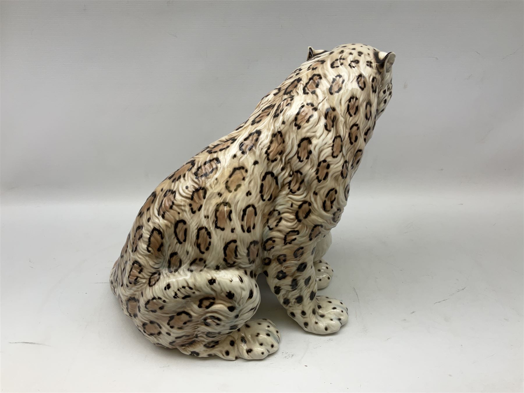 Ronzan fireside model of a snow leopard, with printed mark beneath, H38cm 