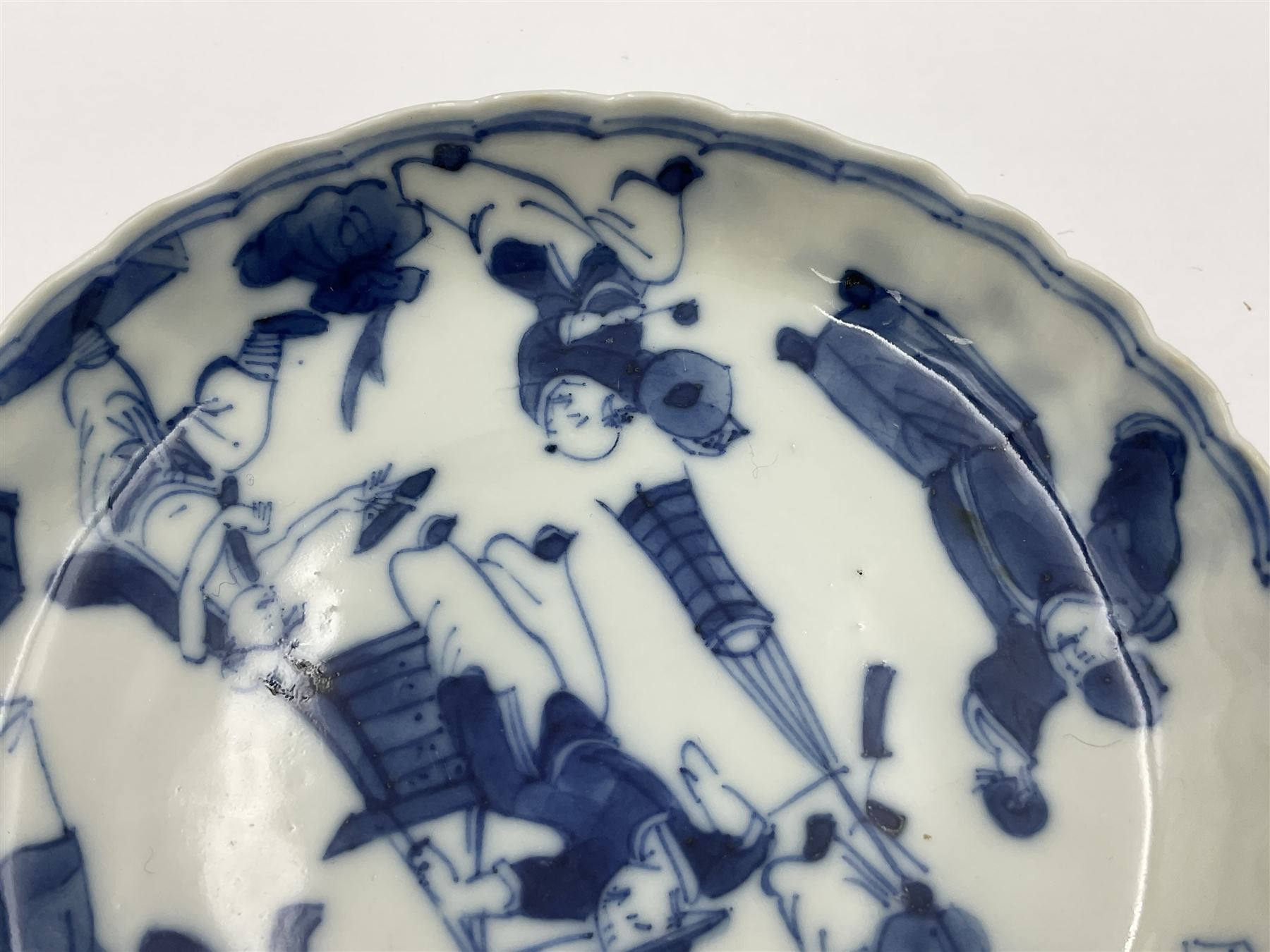 18th century Chinese blue and white Kangxi teacup and saucer, decorated with dancing figures, four character Kangxi mark beneath, saucer D10cm