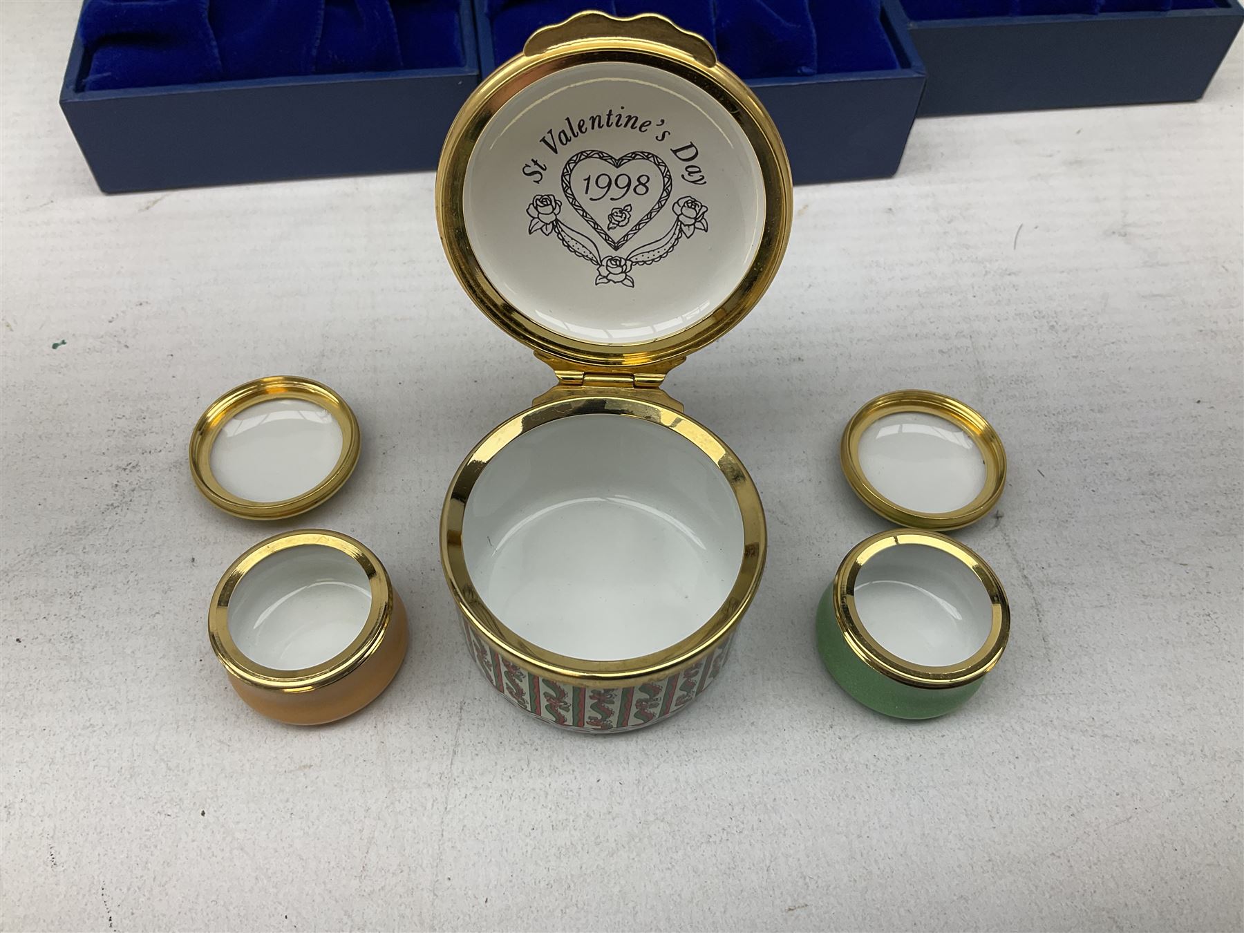 Group of seven Halcyon Days enamel boxes, each with affectionate inscriptions, including 'Wild about you', 'Don't ever change', 'Love you a bunch', etc., in six fitted boxes  