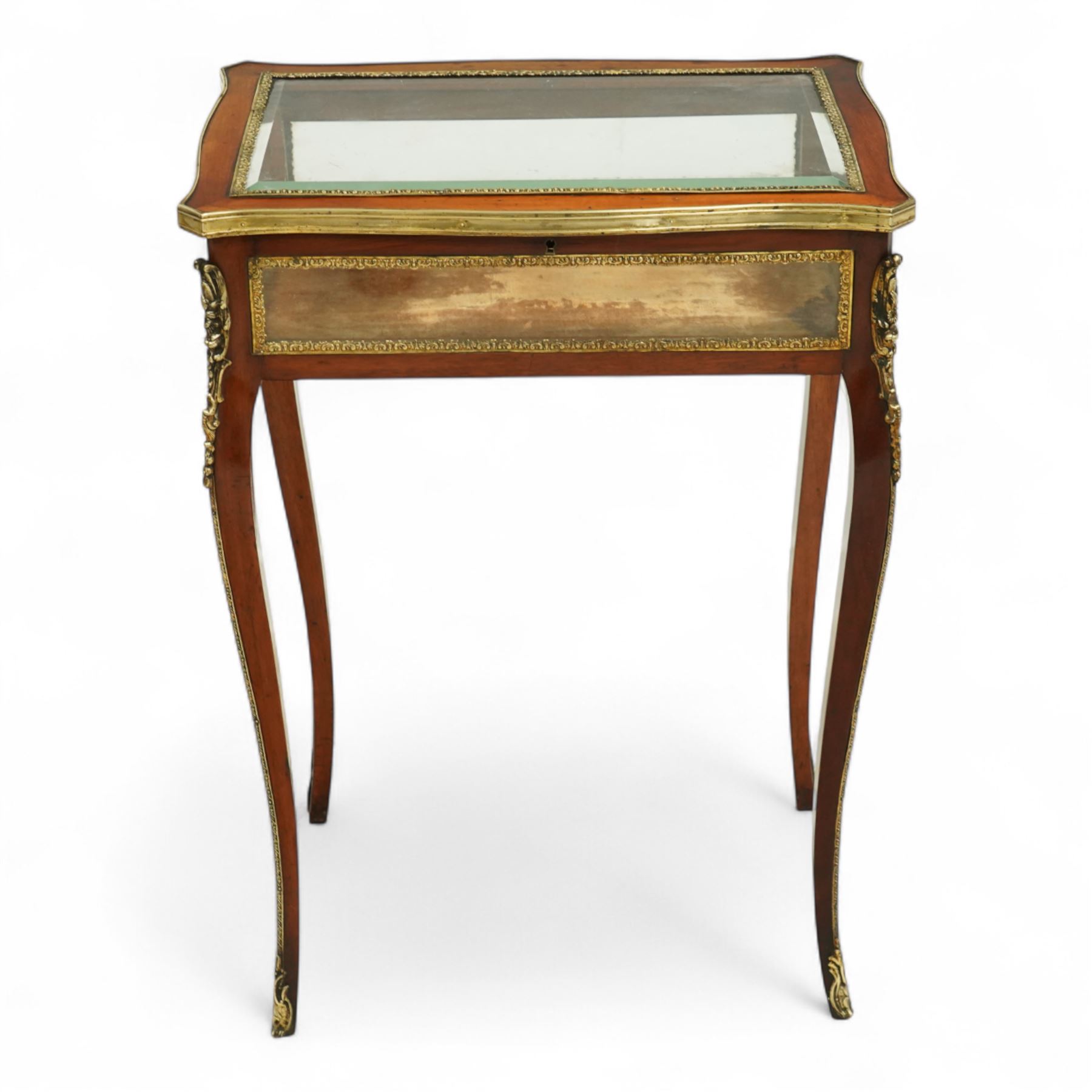19th century, Louis XV style, bronze mounted bijouterie table, the hinged rectangular bevelled glass top with gilt bronze foliate beading, side glass panels  and plush-lined velvet interior, raised on cabriole legs, with gilt bronze masks and sabots