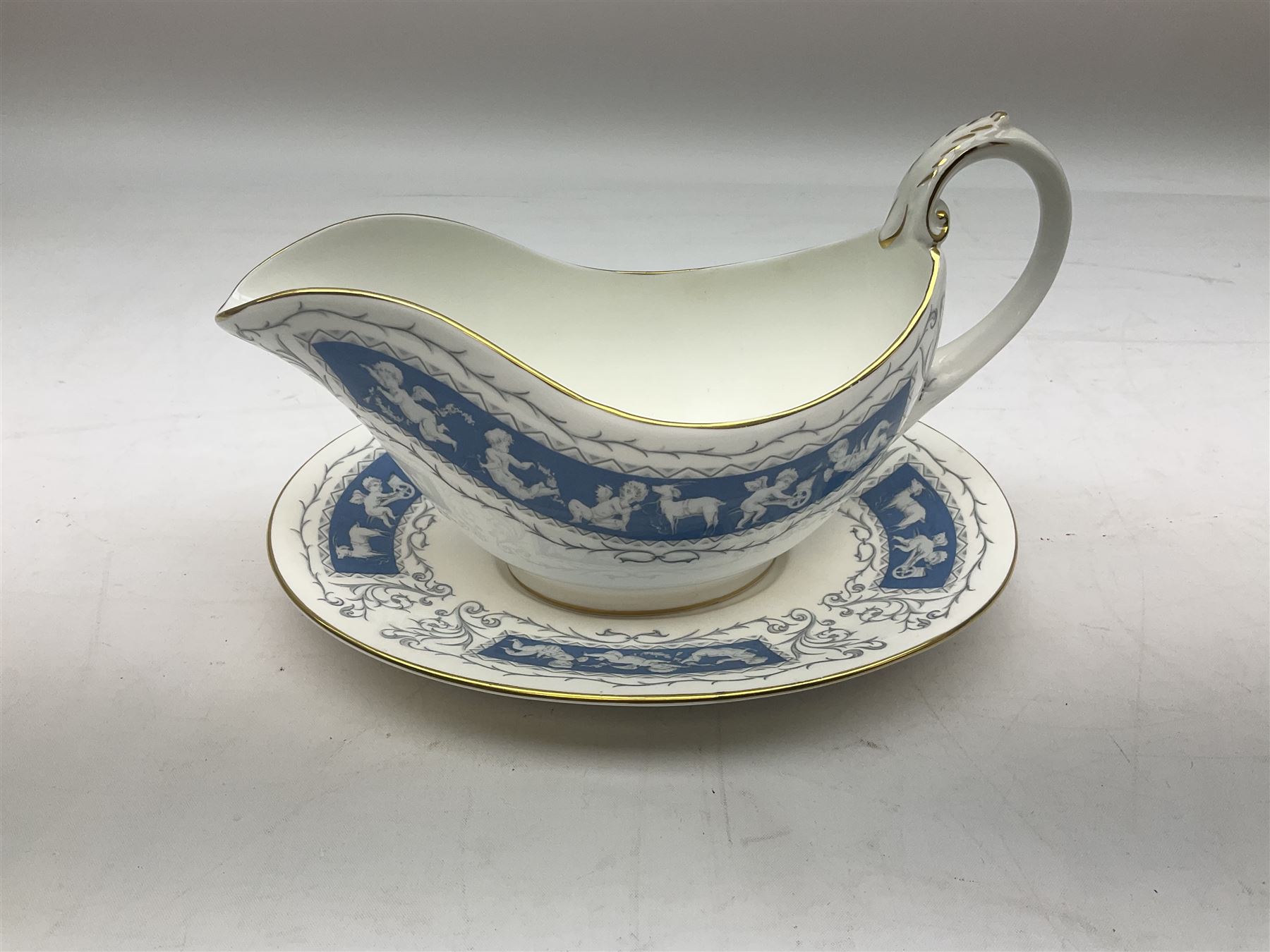 Coalport Revelry pattern tea and dinner wares, comprising nine dinner plates, four salad plates, eleven side plates, sauce boat and stand, ten teacups and ten saucers, and preserve pot and cover, together with a Coalport plate of shaped form decorated with pink roses, and a Royal Crown Derby Royal Antoinette pattern trio