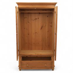 Two contemporary traditional-style wardrobes, projecting plain cornice above two arched moulded panel doors, above a full-width drawer fitted with turned wooden handles, raised on turned bun feet