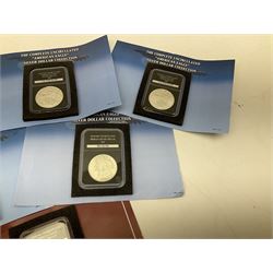 Eleven United States of America silver dollar coins from ‘The complete uncirculated American Eagle Silver Dollar Collection’, each housed in a rectangular capsule