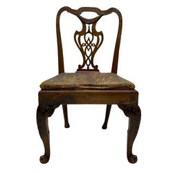 George II elm side chair, shaped foliate carved cresting rail over pierced splat carved with linenfold swag, the seat upholstered in embossed leather cover with foliate scroll decoration, moulded seat rails over acanthus carved cabriole supports with scroll carved terminals