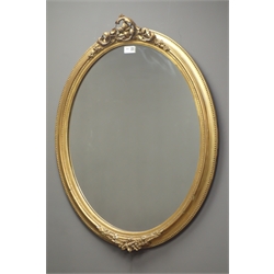  Ornate oval gilt framed mirror, W60cm, H78cm  