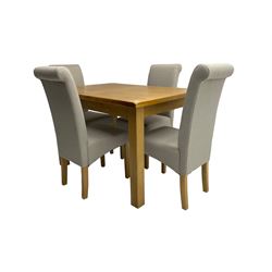 Light oak extending dining table, rectangular top on square supports (W120cm D85cm H80cm); and set four dining chairs, back and seat upholstered in cream fabric (W46cm H101cm)