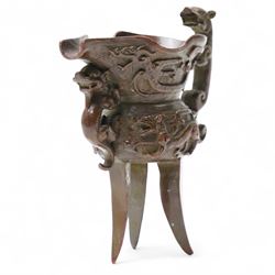 Chinese bronze libation cup with Zoomorphic handle on a tripod base H13cm