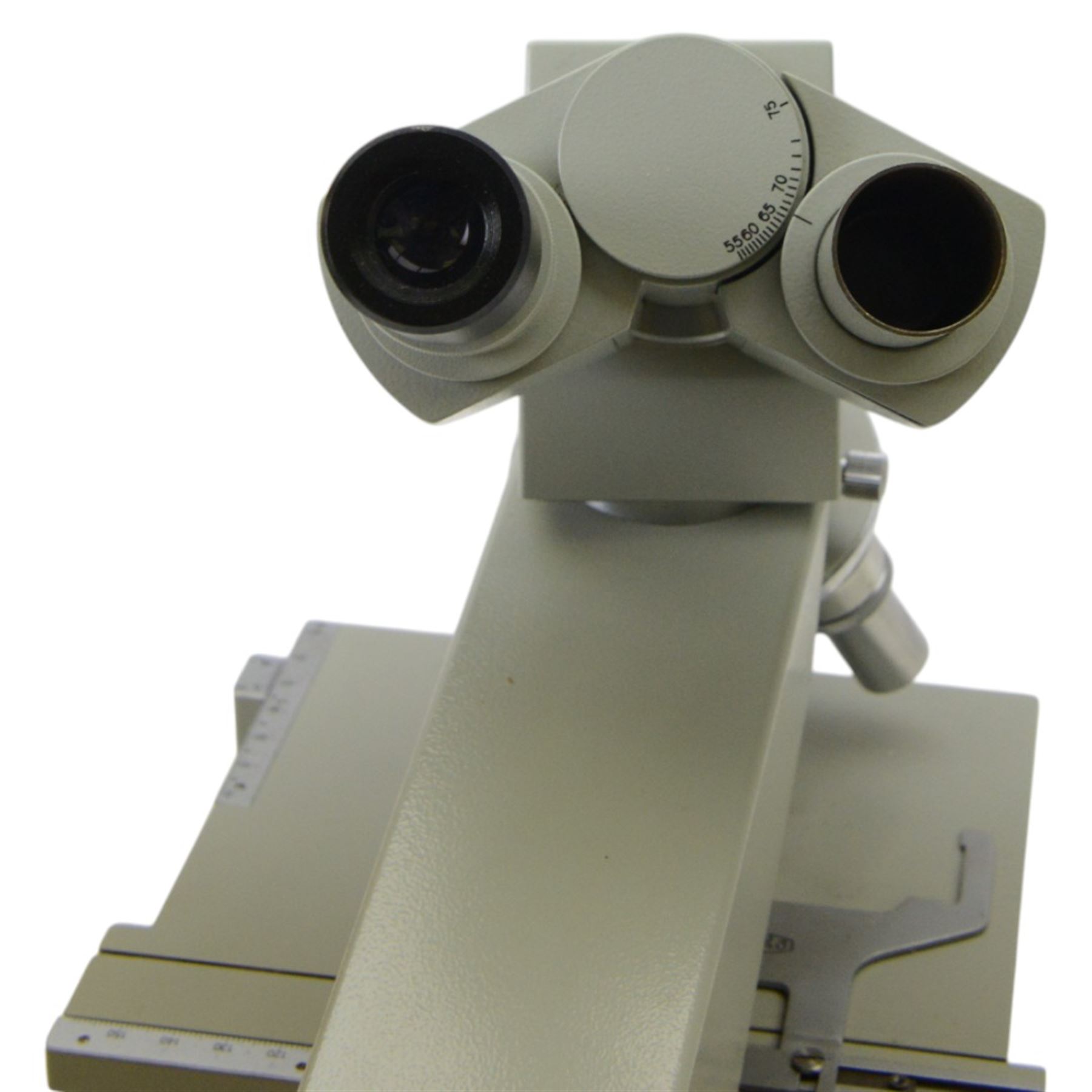 Three microscopes, including Griffin Student Vernier Microscope, Vickers Instruments binocular microscope with Leitz Wetzlar Periplan 10x lenses, and a Carl Zeiss Jena binocular microscope in a wooden Olympus Tokyo box