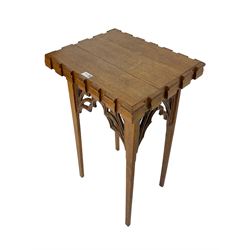 20th century ecclesiastical Gothic style oak stand, rectangular top on four square tapering supports, with pierced and carved tracery brackets