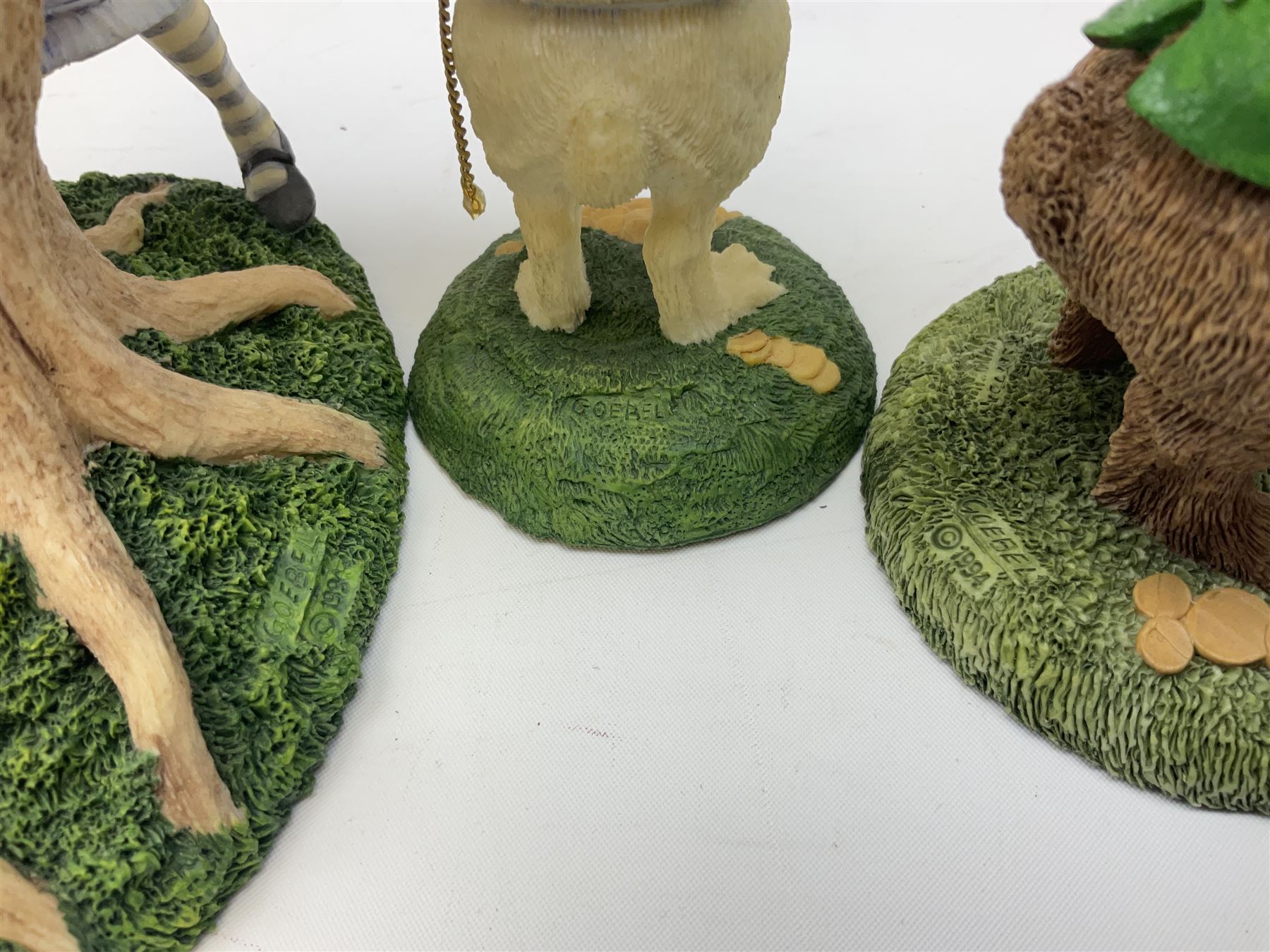 Goebel Alice in Wonderland figures, comprising Alice and Cat, White Rabbit, Queen of Hearts, March Hare, Tweedle Dee and the Mock Turtle, largest H18cm