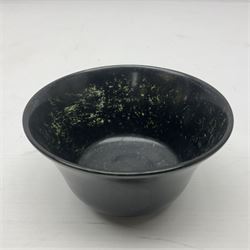 Polished hardstone footed bowl, together with another, possibly spinach jade, bowl, largest D12cm    