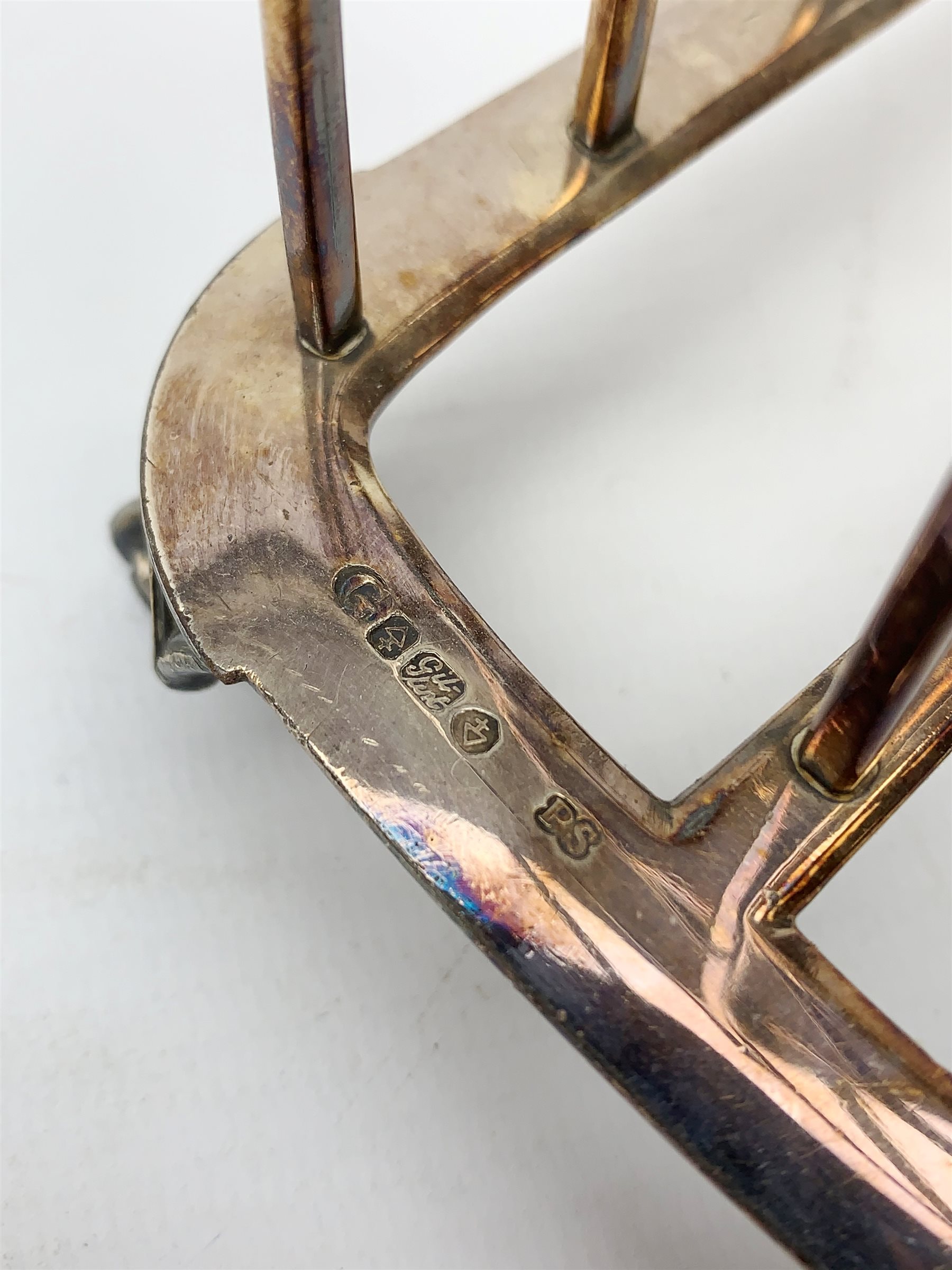 Victorian electroplate Gothic style toast rack, with seven arched bars, openwork handle and arcaded bracket feet, marks for John Gilbert, H25cm   