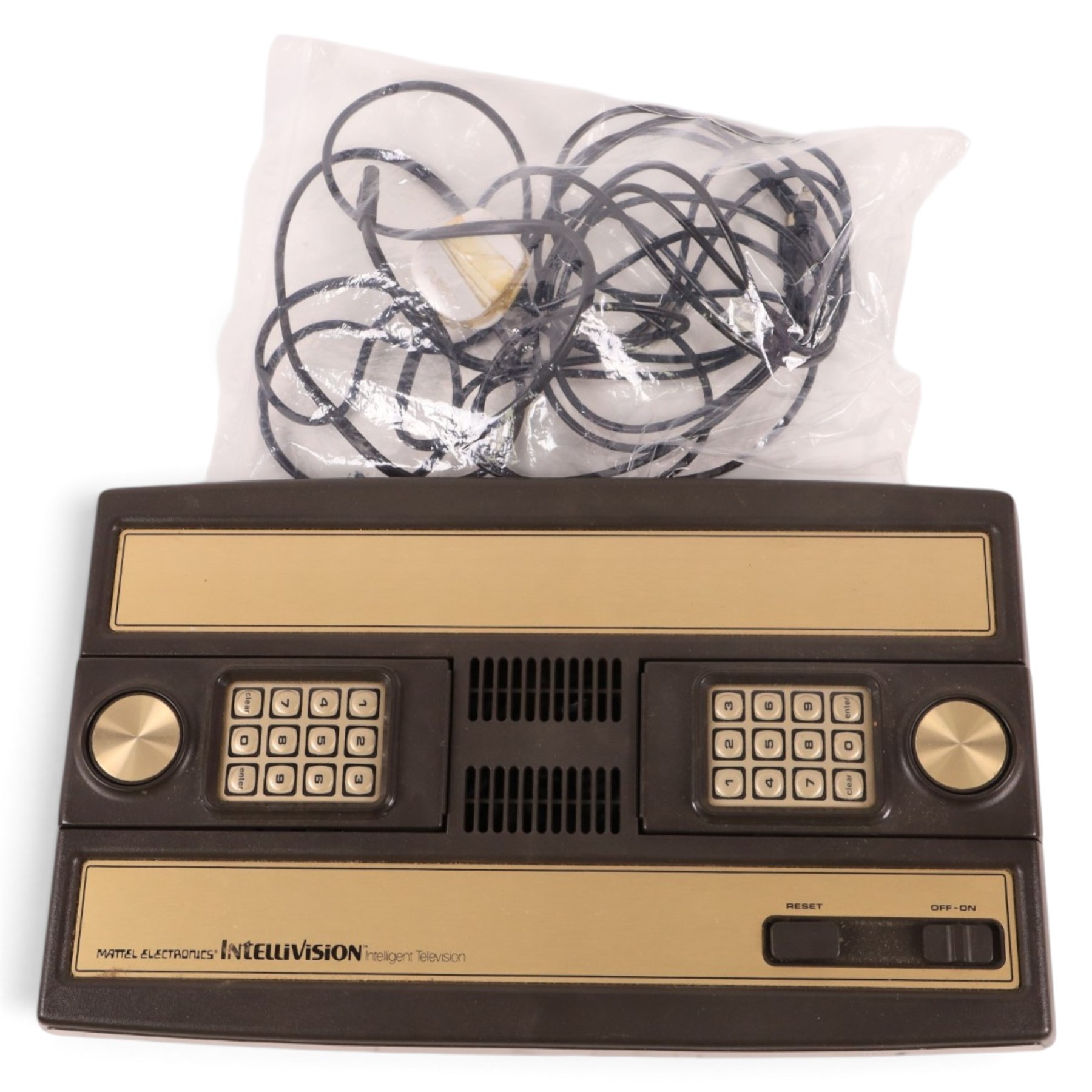 Mattel Electronics Intellivision Intelligent Television Master Component and twenty boxed games comprising Golf, Soccer, Lock N Chase, Reversi, Night Stalker, Math Fun, Baseball, Shark! Shark!, Skiing, Tutankham, Frogger, Popeye, Advanced Dungeons & Dragons, Draughts, Triple Action, Frog Bog, Mission-X, Space Battle, Bowling and Auto Racing 
