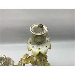 Dresden style candelabra, the central stem bordered by three branches, decorated with cherubs and yellow roses, H48cm