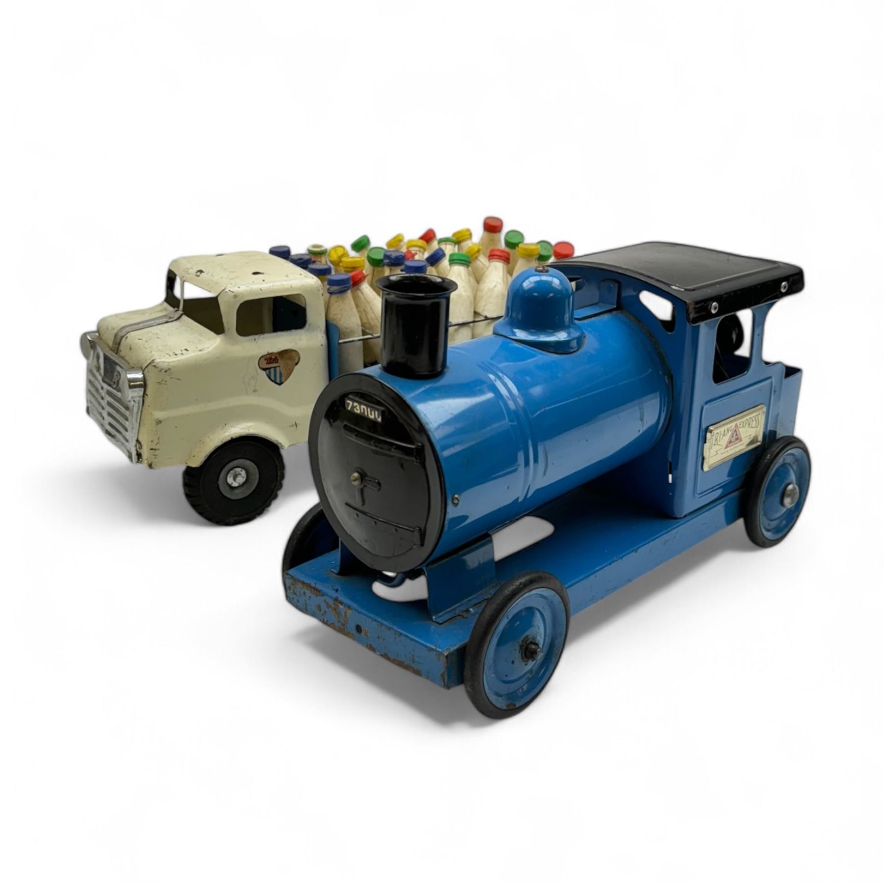 1950s Triang pressed steel milk float, containing twenty eight plastic milk bottles with coloured tops, together with a 1950s Triang pressed steel locomotive 'Triang Express', tallest H21cm