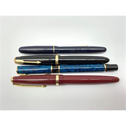 A group of four fountain pens, comprising Parker Duofold, nib marked 14K, Swan Mabbie Todd & Co Ltd Self Filler, nib marked 14C 585, Conway 57, nib marked 14ct, and Waterman Laureat. 