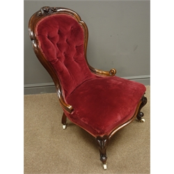  Victorian walnut framed Nursing chair, upholstered in red velvet, carved cresting rail and foliate cabriole legs, W59cm  
