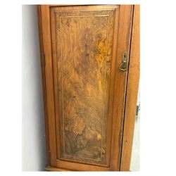 Late Victorian walnut triple combination wardrobe, projecting moulded and dentil cornice, central shaped bevelled mirror glazed door, cartouche and curled leaf carved panels over figured walnut veneered panels, fitted with drawer to base, on bracket feet