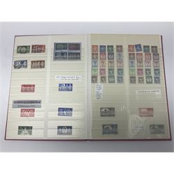 Mostly Great British stamps, including King Edward VII two shillings and sixpence, five shillings and ten shillings, King George V seahorses, King George VI high values, Queen Elizabeth II pre and post decimal etc, housed in a pink stockbook 