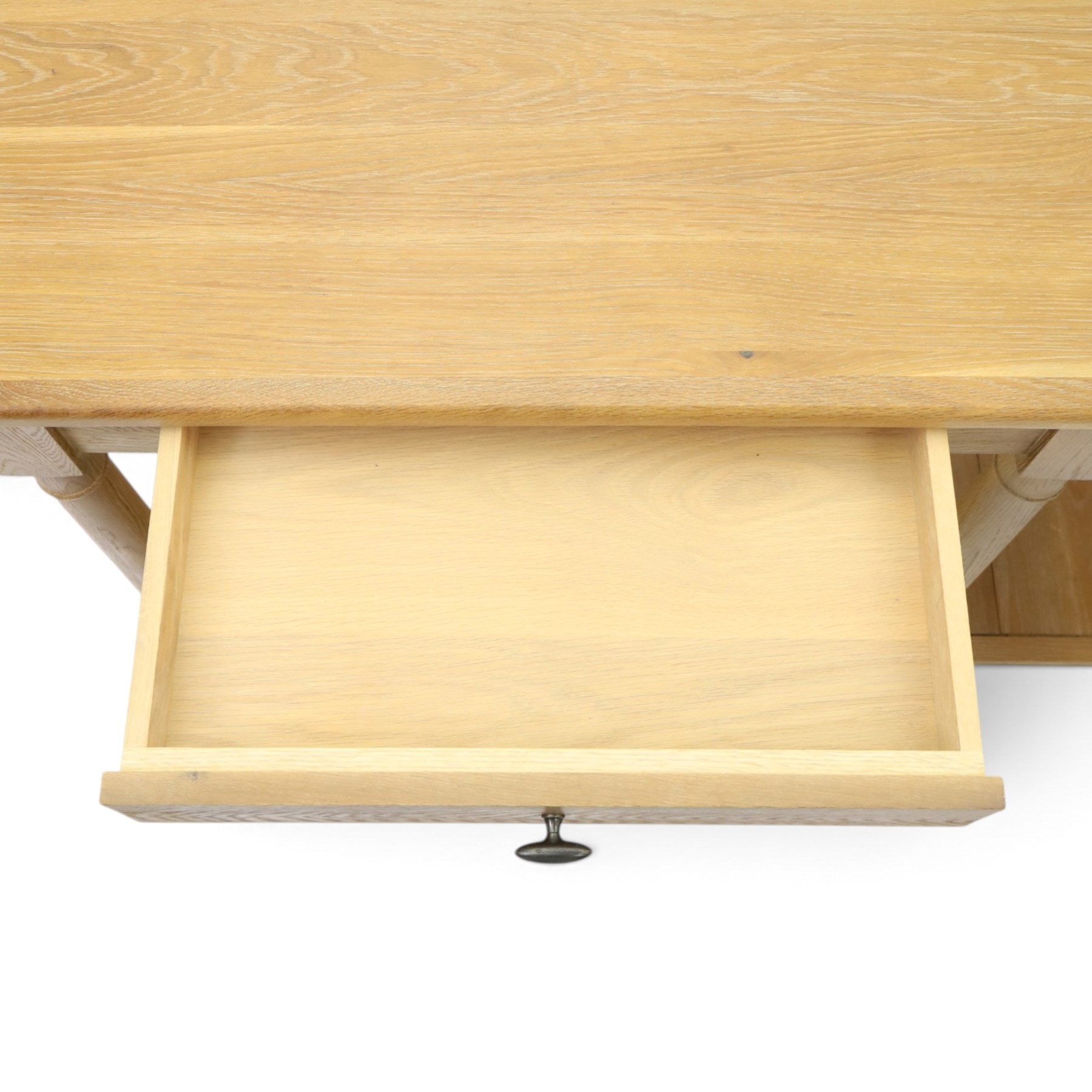 Neptune - 'Edinburgh' limed oak console table, with two
soft close drawers raised on ring-turned column supports,
with a pot shelf raised on square feet