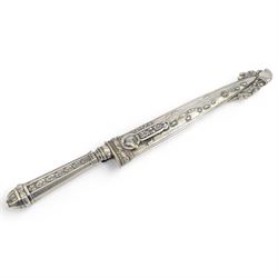 Argentinian Gaucho dagger and scabbard, decorated with oak leaves and cattle scenes with Inox blade, overall L29cm, blade 17cm