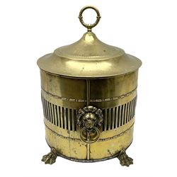 Victorian brass coal bin, the body of cylindrical form with pierced gallery between bead and dart borders, interspersed with patera and two lion mask ring handles, the tapering cover with ring handle lifting to reveal a steel liner, the whole upon four pad feet, H47cm 
