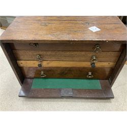 Six shelved cabinets for displaying ‘00’ gauge locomotives comprising plain plywood and white painted examples with track applied to various shelves, largest H63cm, W107cm, D27cm; Collection of tools for building model locomotives to include Weller PU-2D Soldering Pencil and Standard Tip Soldering Iron 20W/230V, Humbrol Modellers Airbrush, Power Supply Units and two wooden chests one of which housing a collection of tools including tweezers, scalping tools, wrenches etc 