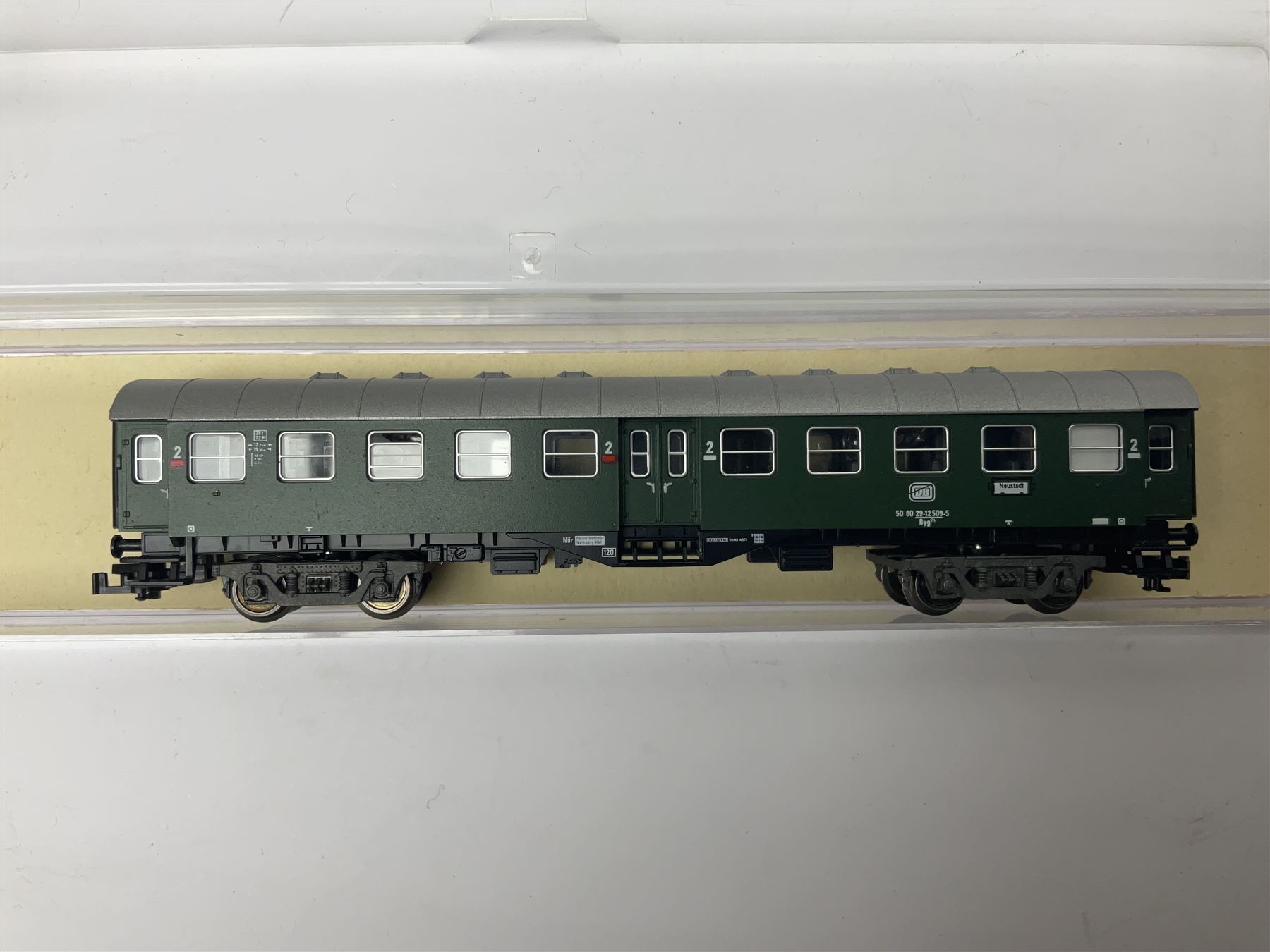 Fleischmann ‘N’ gauge ‘Piccolo’ - sixteen carriages, wagons and cars comprising nos. 8051, 8052, 8055, 8064, 8119K, 8127, 8128, 8129, 8202, 8211, 8224, 8240, 8281, 8301, 8500, 9372; along with Minitrix N503 Shock Van and 13576 6 ton Mineral Wagon; boxed and loose (18) 