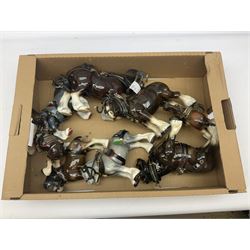 Approximately forty seven ceramic Shire horses to include Sylvac and Melba Ware examples of various sizes and colours, many with harnesses, and a quantity of carts and wagons 