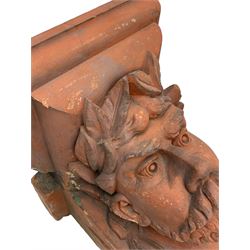 Jabez Thompson (Northwich 1838-1911) - pair of Victorian terracotta wall brackets or corbels, stepped ovolo cornice over masks in the form of a Classical male, wearing a laurel wreath with moustache and beard, stamped to underside