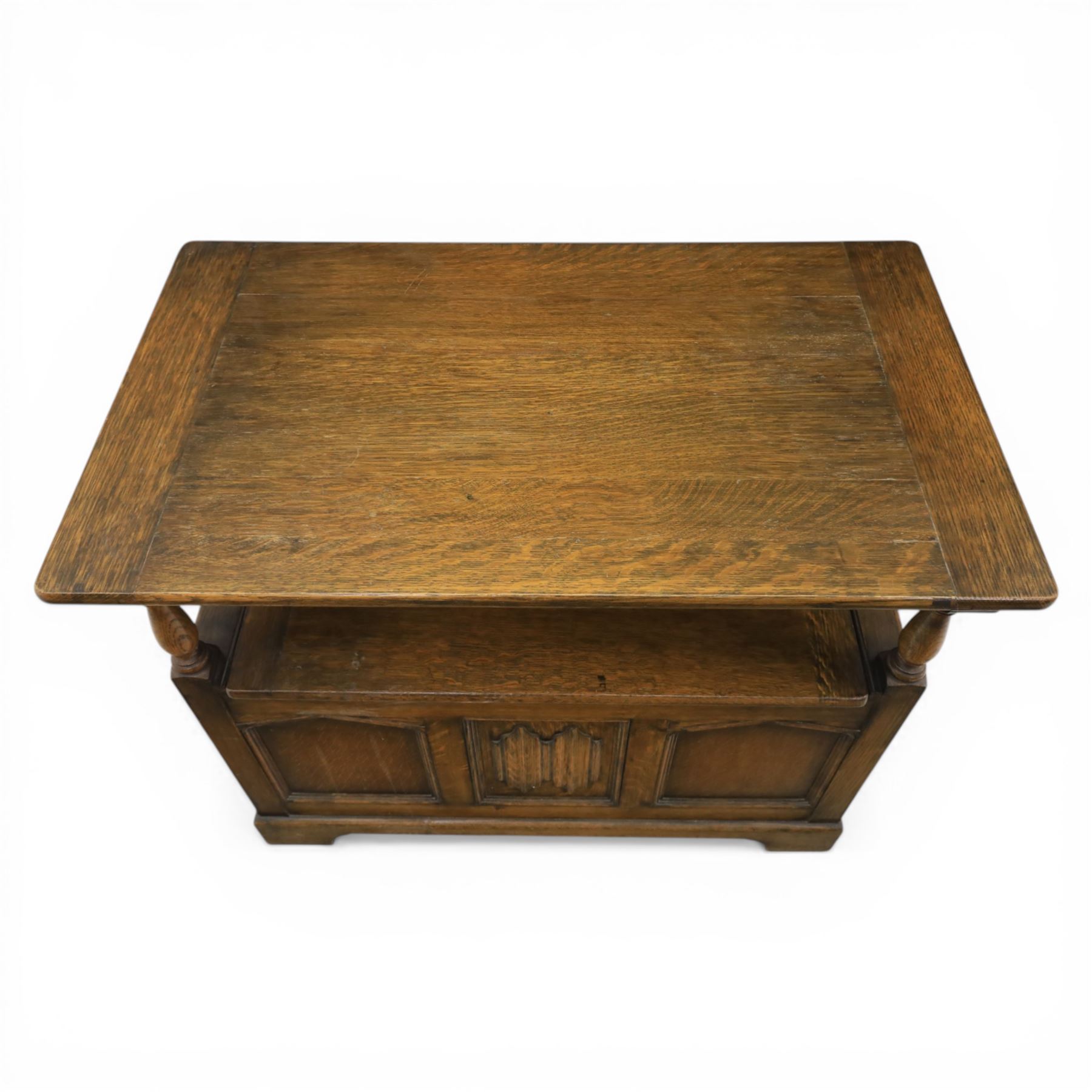 20th century oak monks bench with hinged box seat, with blind fretwork to the seat, panelled front and sides with linen fold panel in the centre